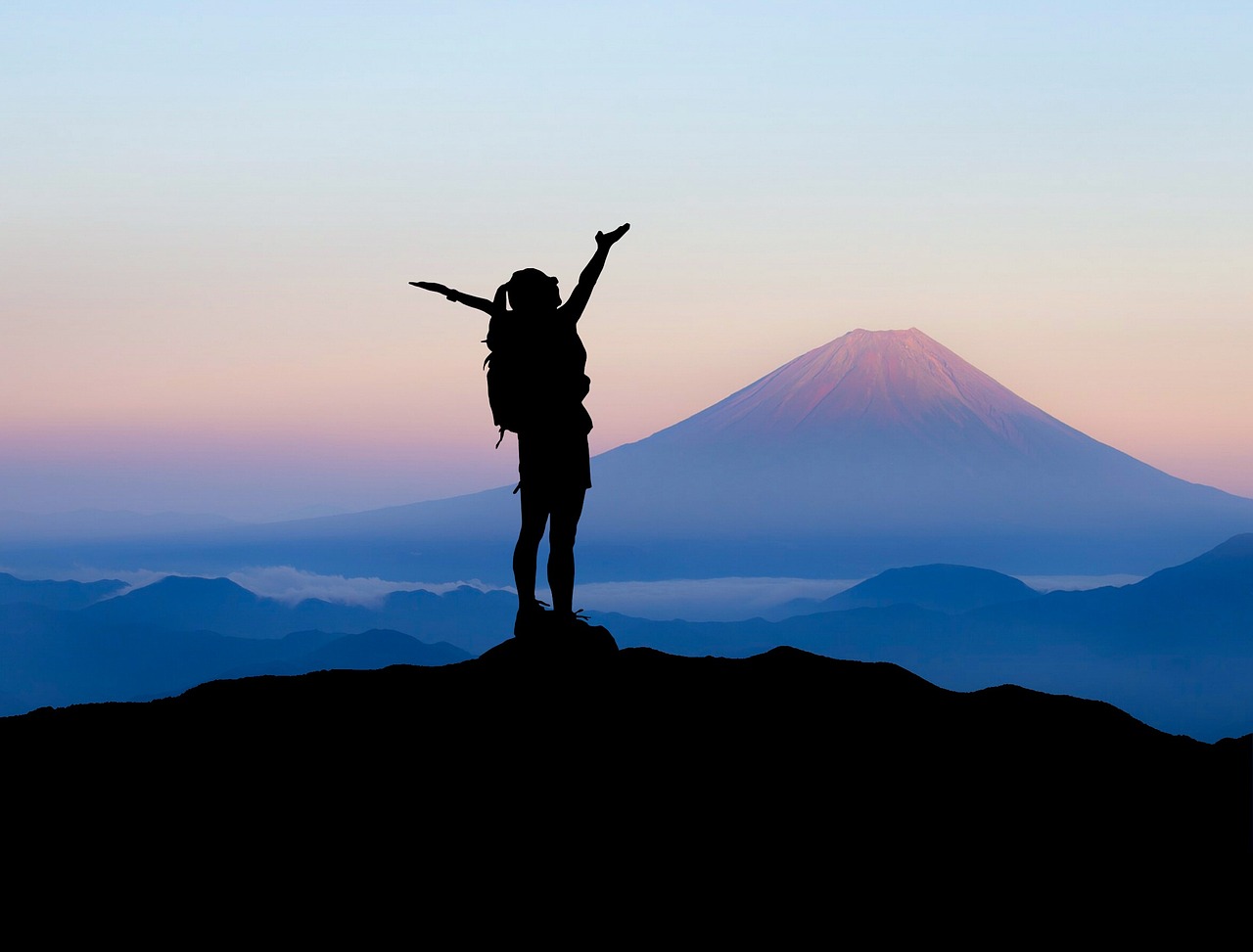 person on top of mountain